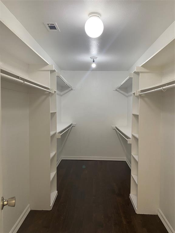 6005 Black Berry Lane Dallas, TX 75248 - Photo 18 of 22 a view of a room with racks on the wall