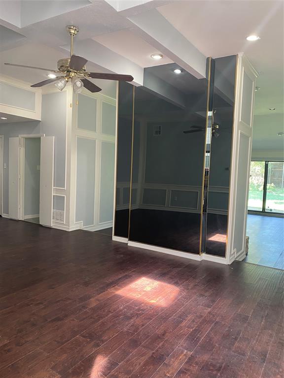 6005 Black Berry Lane Dallas, TX 75248 - Photo 3 of 22 a view of livingroom with an empty space and a ceiling fan
