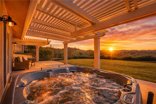 a bed sitting in a bedroom next to a large window