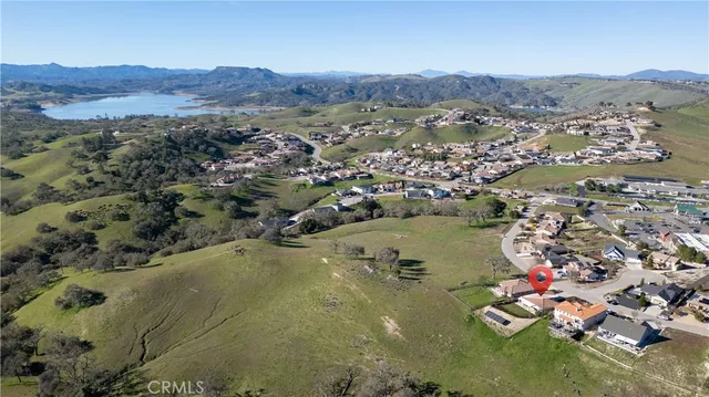 an aerial view of a residential houses with outdoor space
