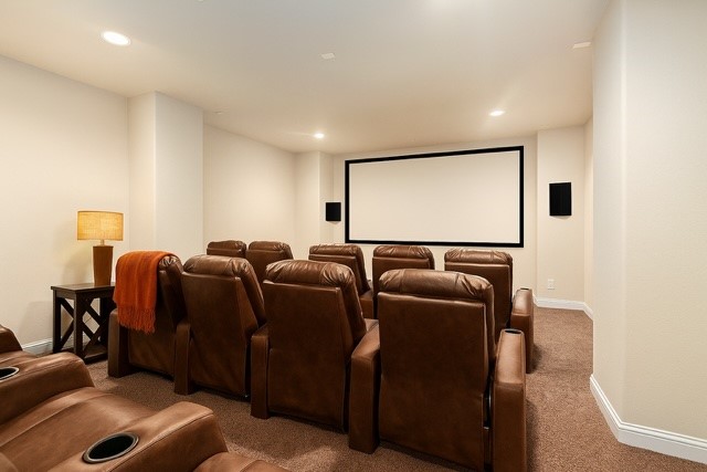 18614 Rimini Ridge Court Cypress, TX 77429 - Photo 11 of 35 a media room with lots of chairs and a projector screen