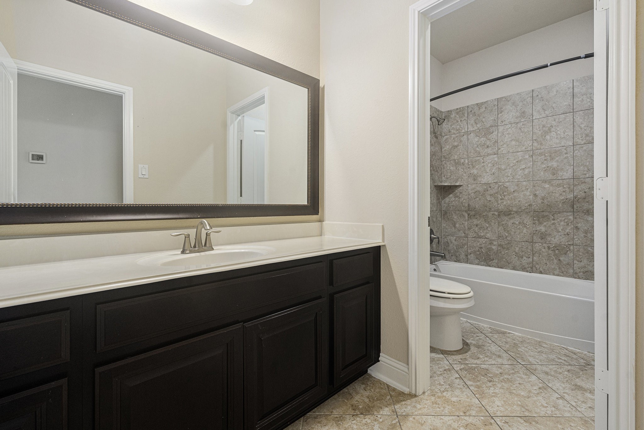18614 Rimini Ridge Court Cypress, TX 77429 - Photo 26 of 35 a bathroom with a sink and a toilet