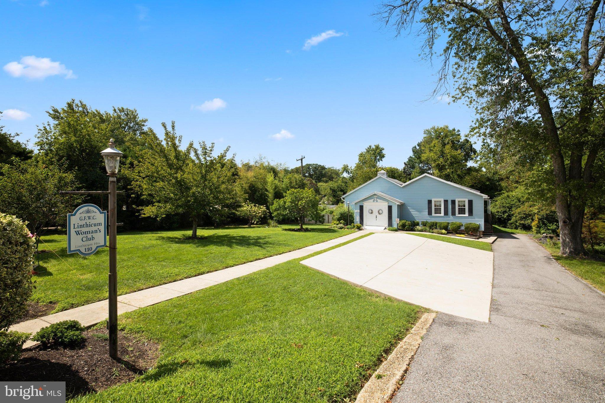 522 Old Hammonds Ferry Road Linthicum Heights, MD 21090 - Photo 83 of 109 Charming blue club nestled in lush greenery.