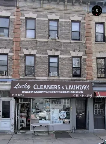a view of a brick building with a window and a fireplace