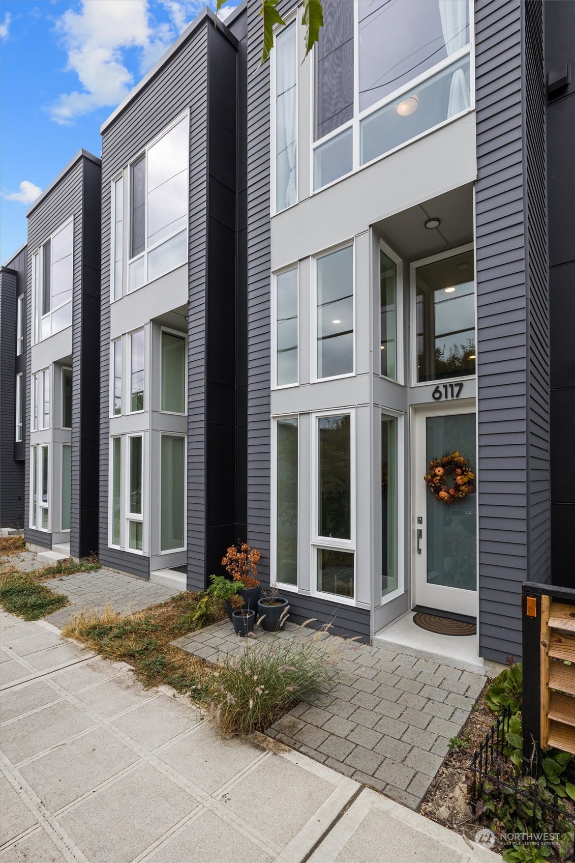 6117 17th Avenue Northwest Seattle, WA 98107 - Photo 1 of 27 a view of a brick house with a large windows