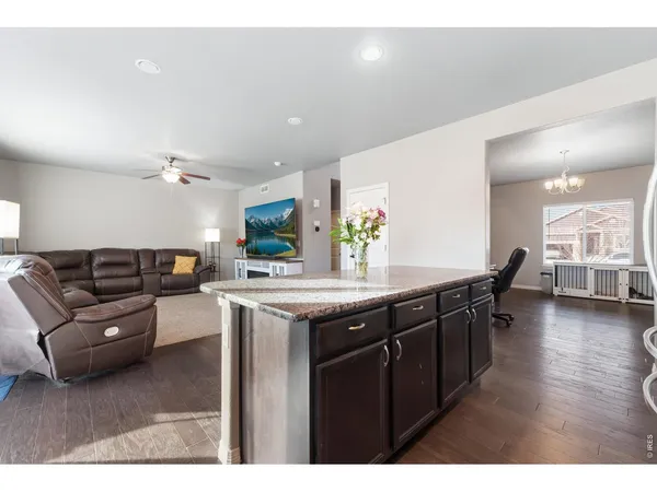a kitchen with a stove a sink and a refrigerator