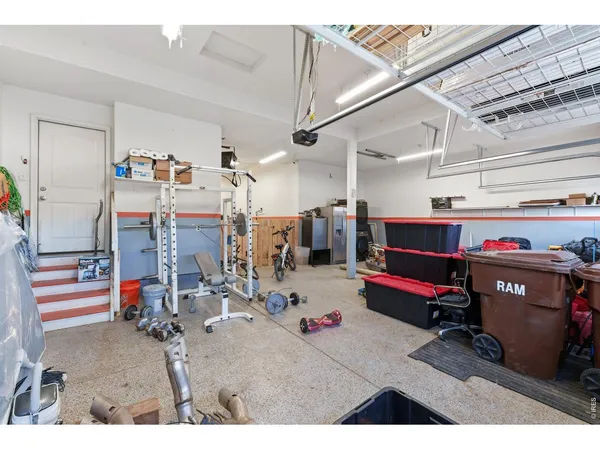 a storage utility room with a lot of gym equipment