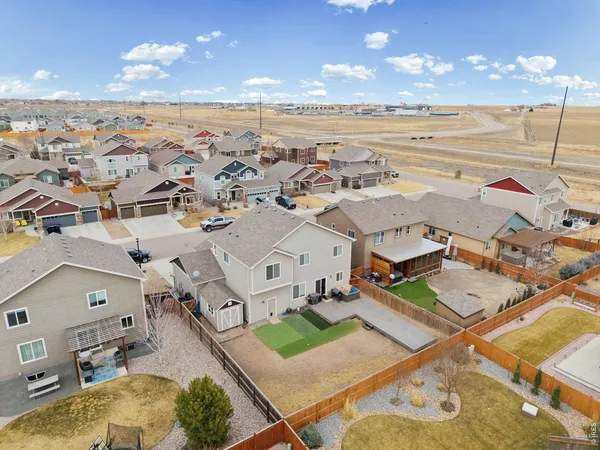 an aerial view of residential houses with outdoor space
