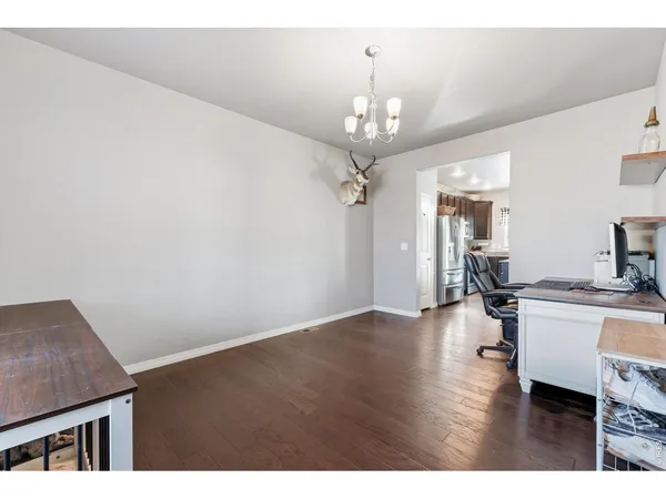 a view of a livingroom with furniture and wooden floor