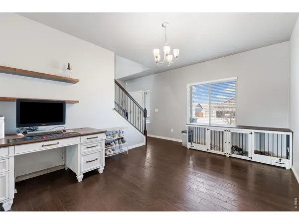 a view of a livingroom with an empty kitchen