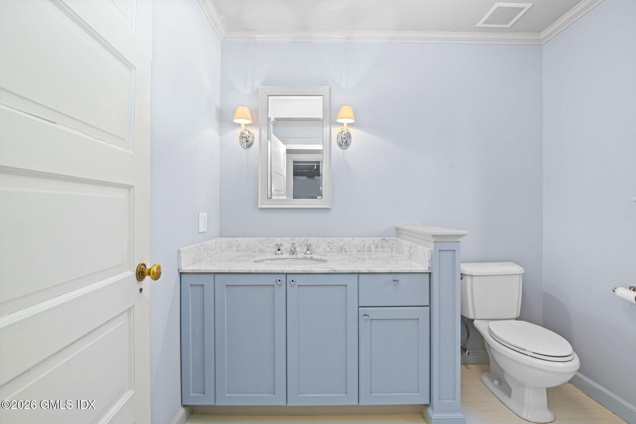 164 Round Hill Road Greenwich, CT 06831 - Photo 54 of 67 a bathroom with a sink a toilet and mirror