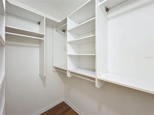 a view of an empty walk in closet