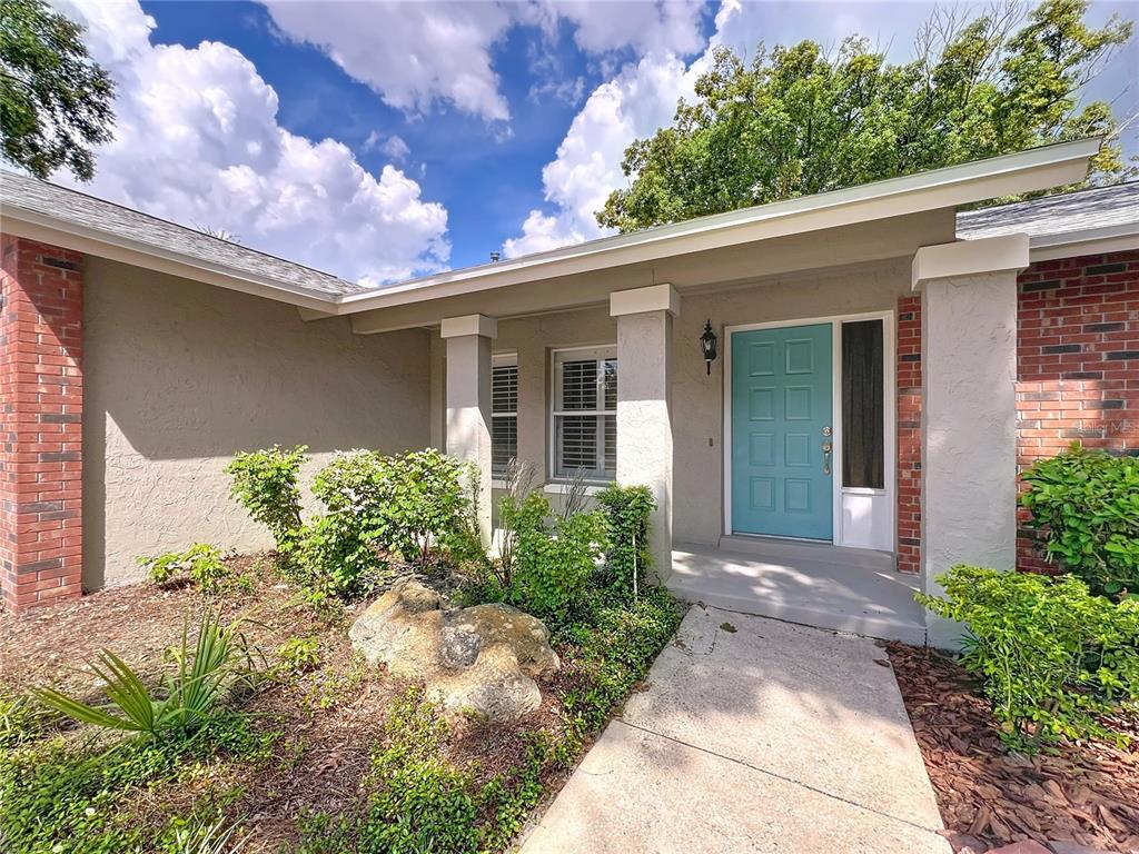 8029 Gillette Court Orlando, FL 32836 - Photo 29 of 32 a front view of a house with garden