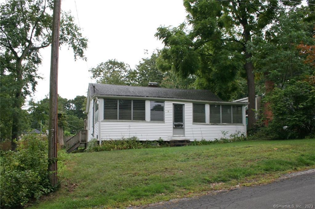 7 Jackman Road Hebron, CT 06231 - Photo 1 of 1 a front view of house with yard and green space