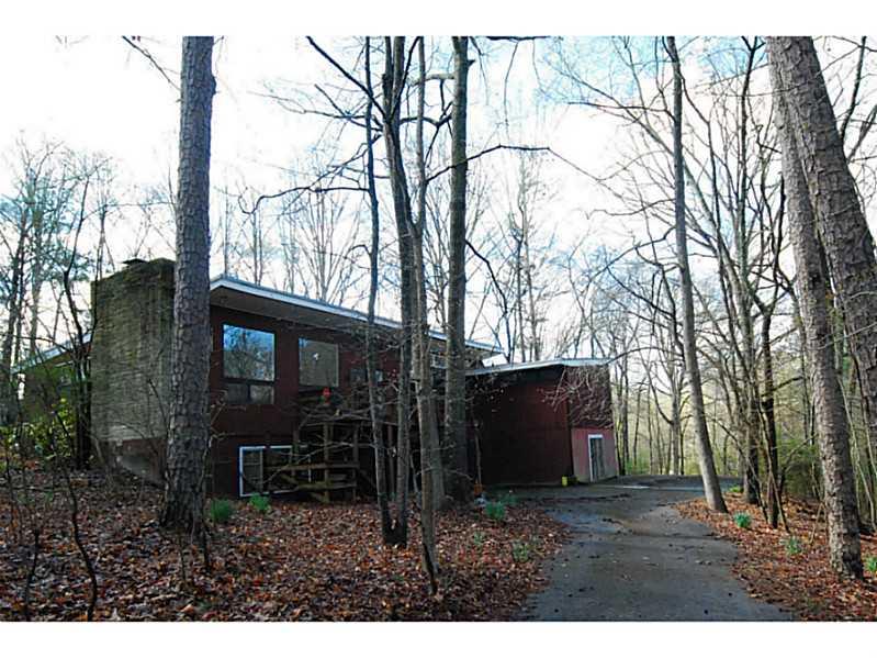 Exterior Front. Up on  ridge overlooking beautiful Wildcat Creek. Huge windows give beautiful views of the forest.