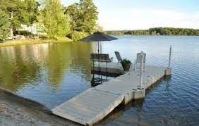 360 Littleton Road, Unit G10 Chelmsford, MA 01824 - Photo 19 of 20 a view of a lake with boats in front of house