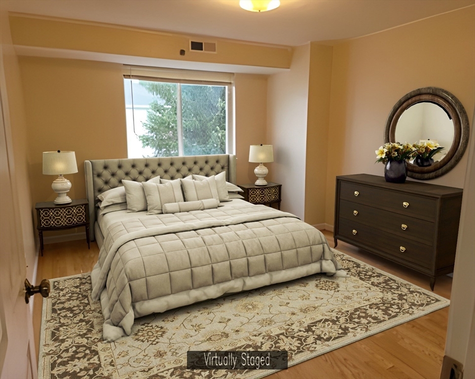 360 Littleton Road, Unit G10 Chelmsford, MA 01824 - Photo 6 of 20 a bedroom with a bed and a dresser