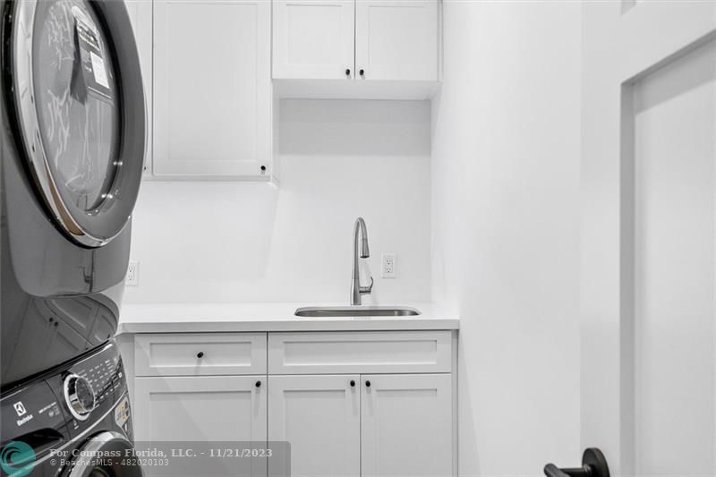 1950 Waters Edge Lauderdale-by-the-Sea, FL 33062 - Photo 11 of 38 a close view of a sink and a utility room in a house