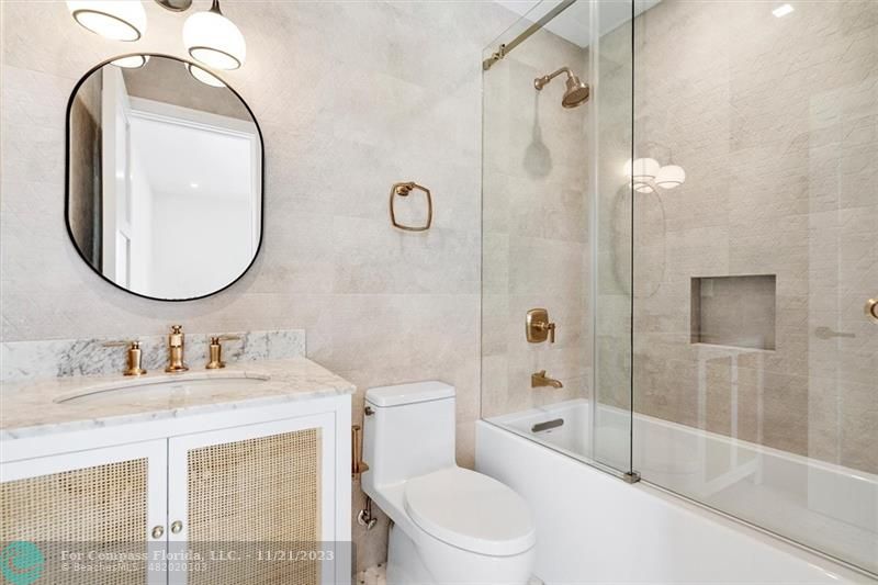 1950 Waters Edge Lauderdale-by-the-Sea, FL 33062 - Photo 14 of 38 a bathroom with a sink a toilet and a mirror