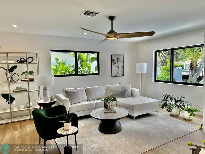 1950 Waters Edge Lauderdale-by-the-Sea, FL 33062 - Photo 15 of 38 a living room with furniture and a large window
