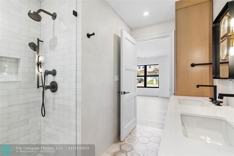 1950 Waters Edge Lauderdale-by-the-Sea, FL 33062 - Photo 16 of 38 a bathroom with a sink and a shower