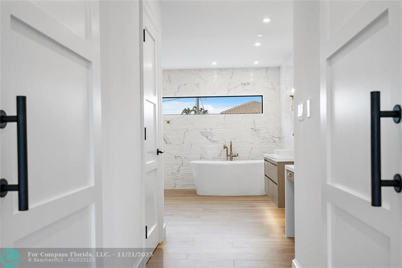 1950 Waters Edge Lauderdale-by-the-Sea, FL 33062 - Photo 18 of 38 a bathroom with a bathtub and a shower