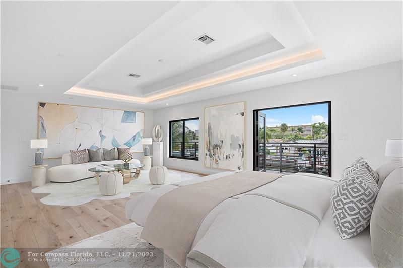 1950 Waters Edge Lauderdale-by-the-Sea, FL 33062 - Photo 20 of 38 a bedroom with a large bed and a large window