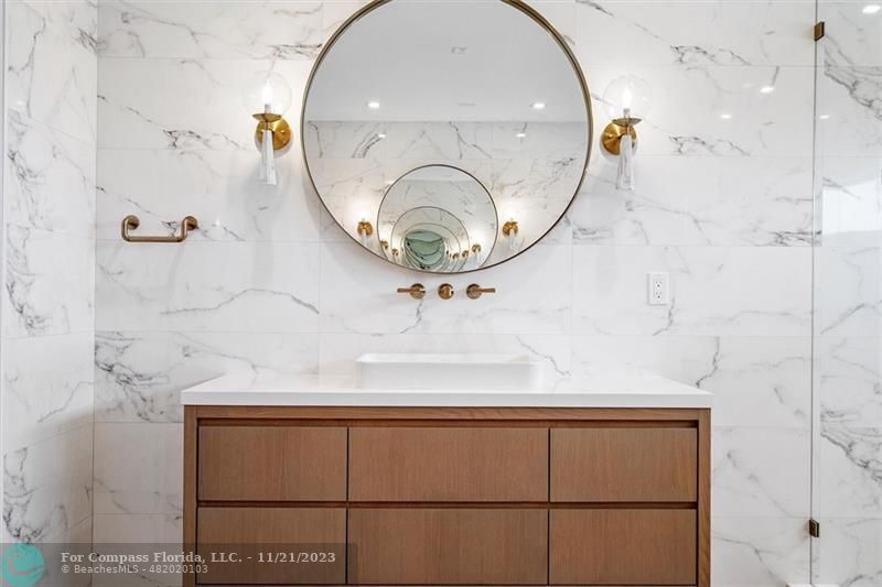 1950 Waters Edge Lauderdale-by-the-Sea, FL 33062 - Photo 23 of 38 a bathroom with a sink and a mirror