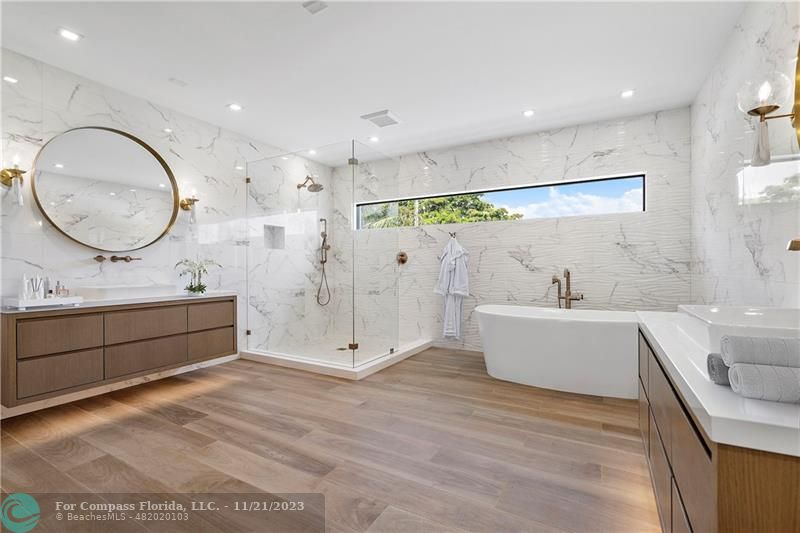 1950 Waters Edge Lauderdale-by-the-Sea, FL 33062 - Photo 25 of 38 a bathroom with a double vanity sink mirror and shower