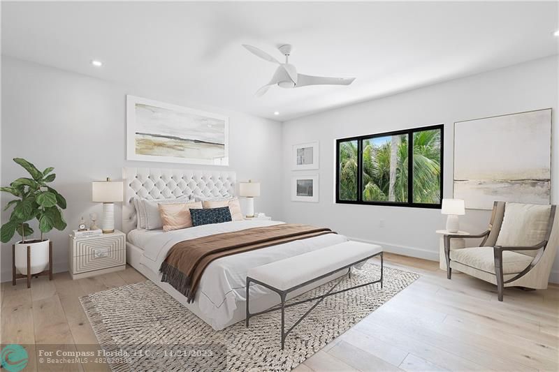 1950 Waters Edge Lauderdale-by-the-Sea, FL 33062 - Photo 26 of 38 a bedroom with a large bed and a couch