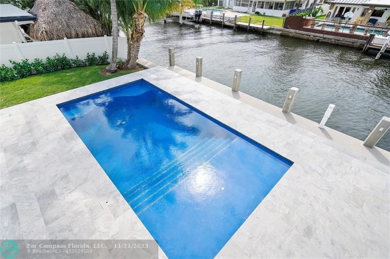 1950 Waters Edge Lauderdale-by-the-Sea, FL 33062 - Photo 33 of 38 a view of a swimming pool with lounge chair