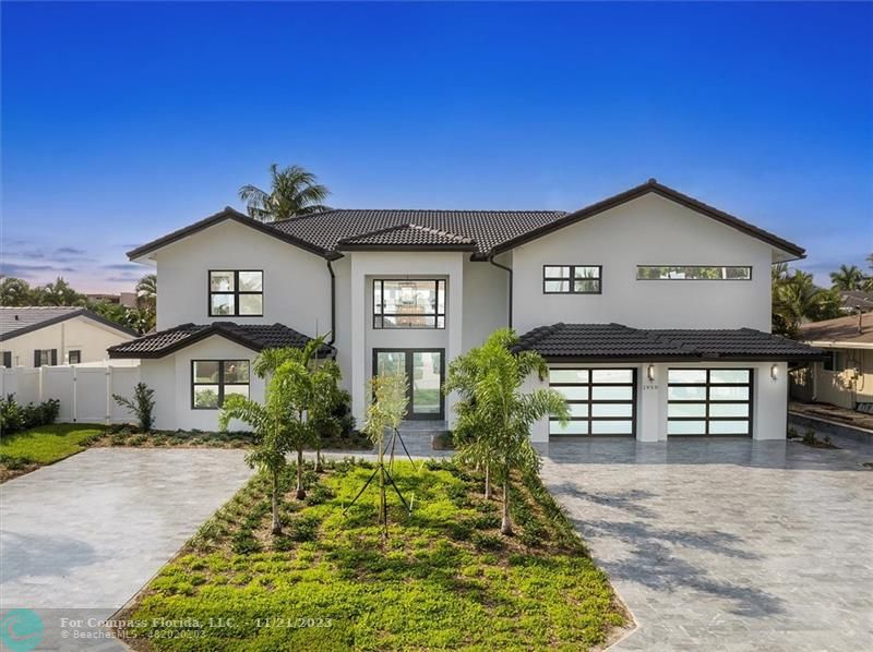 1950 Waters Edge Lauderdale-by-the-Sea, FL 33062 - Photo 36 of 38 a front view of a house with a yard
