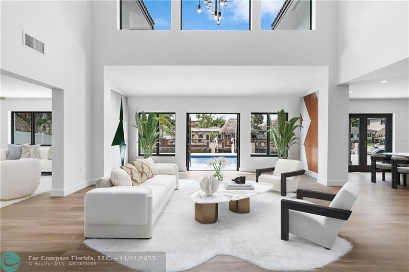 1950 Waters Edge Lauderdale-by-the-Sea, FL 33062 - Photo 5 of 38 a living room with furniture and a large window