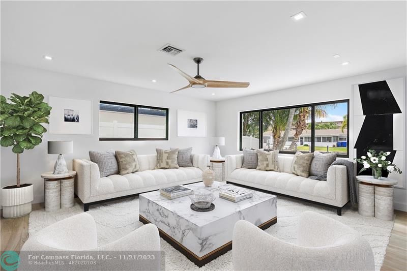 1950 Waters Edge Lauderdale-by-the-Sea, FL 33062 - Photo 6 of 38 a living room with furniture and a large window