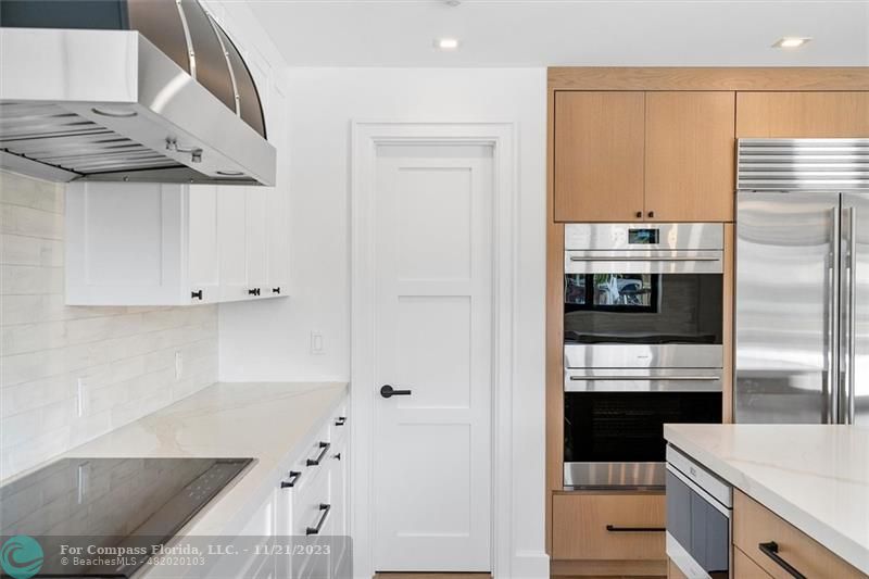 1950 Waters Edge Lauderdale-by-the-Sea, FL 33062 - Photo 8 of 38 a kitchen with stainless steel appliances a refrigerator and a stove