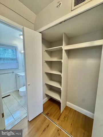 a view of an empty walk in closet