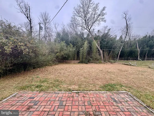 a house with trees in the background