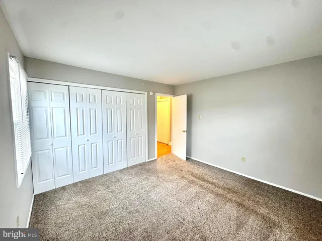 an empty room with a empty space and a window