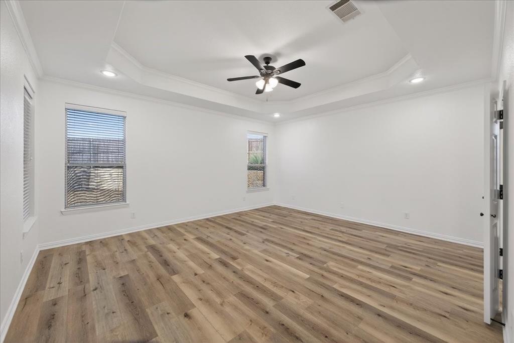 313 Nutmeg Court Burleson, TX 76028 - Photo 17 of 40 wooden floor in an empty room with a window