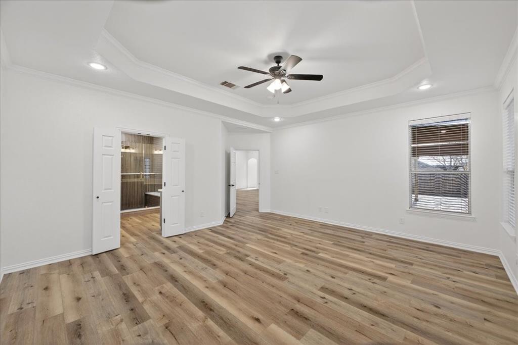 313 Nutmeg Court Burleson, TX 76028 - Photo 20 of 40 a view of an empty room with wooden floor and a window