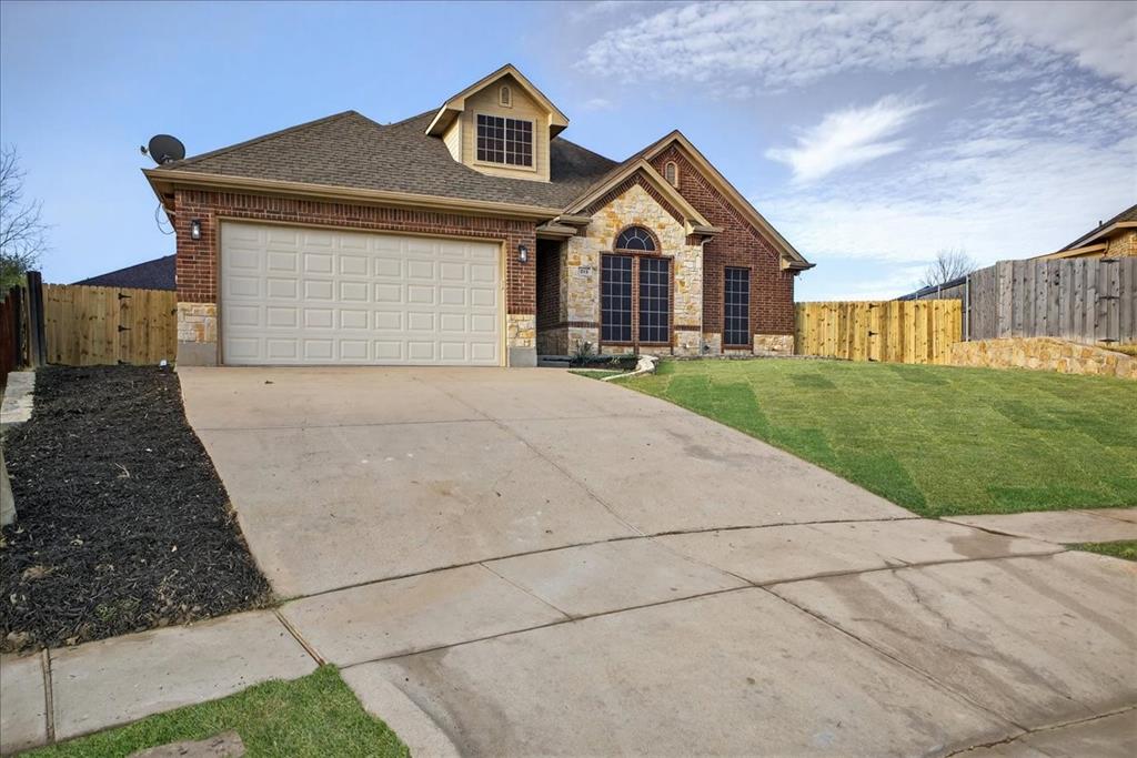 313 Nutmeg Court Burleson, TX 76028 - Photo 2 of 40 a front view of a house with yard