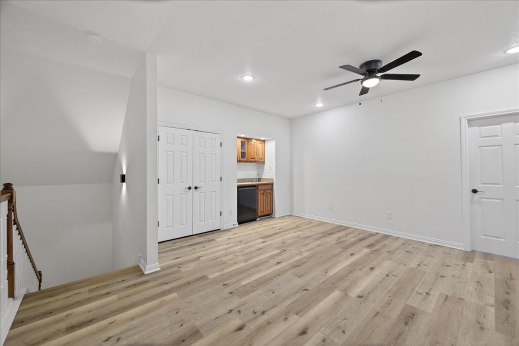 313 Nutmeg Court Burleson, TX 76028 - Photo 27 of 40 a view of a livingroom with wooden floor and a ceiling fan