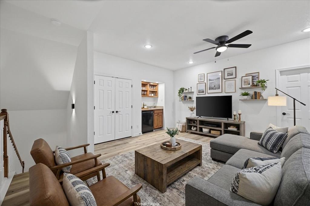 313 Nutmeg Court Burleson, TX 76028 - Photo 28 of 40 a living room with furniture and a flat screen tv