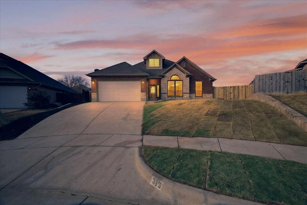 313 Nutmeg Court Burleson, TX 76028 - Photo 3 of 40 a house view with a garden space
