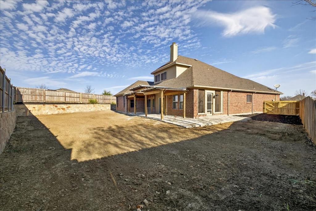 313 Nutmeg Court Burleson, TX 76028 - Photo 36 of 40 a house with yard in front of it