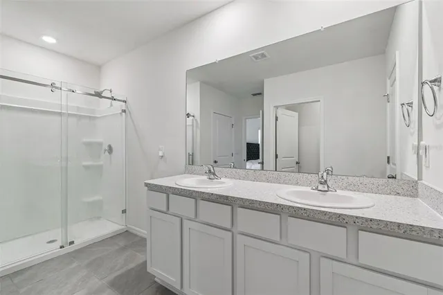 a view of a dining room with furniture and potted plant