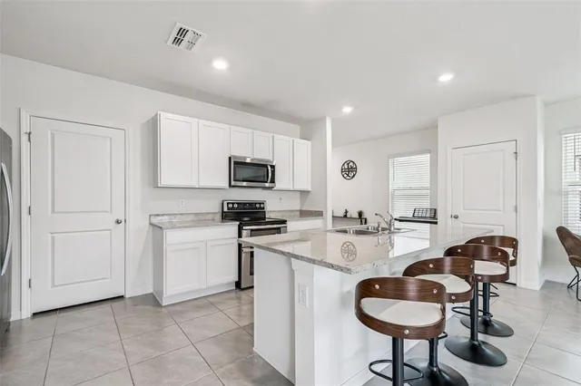 a bedroom with a bed and dresser