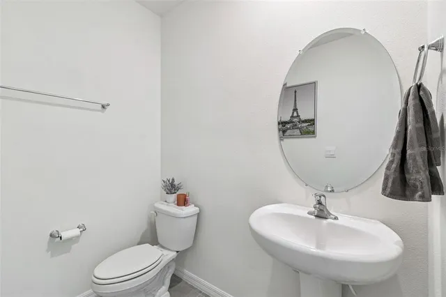 a bedroom with a bed and a night stand