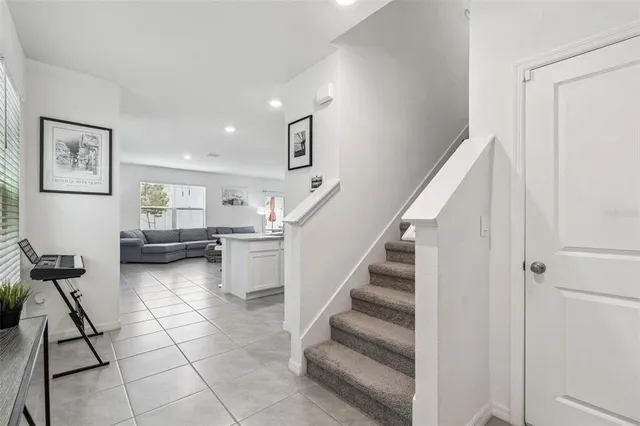 a large bed sitting in a bedroom and dresser