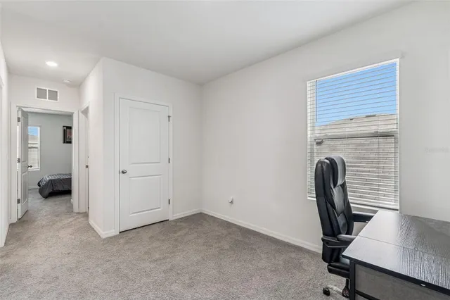 a view of a house with backyard and garage
